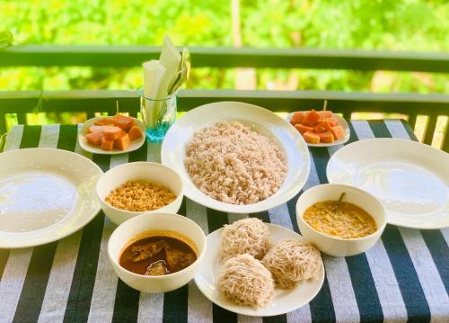 Close-up of a traditional Sri Lankan breakfast platter with fresh fruits hoppers and sambol included complimentary